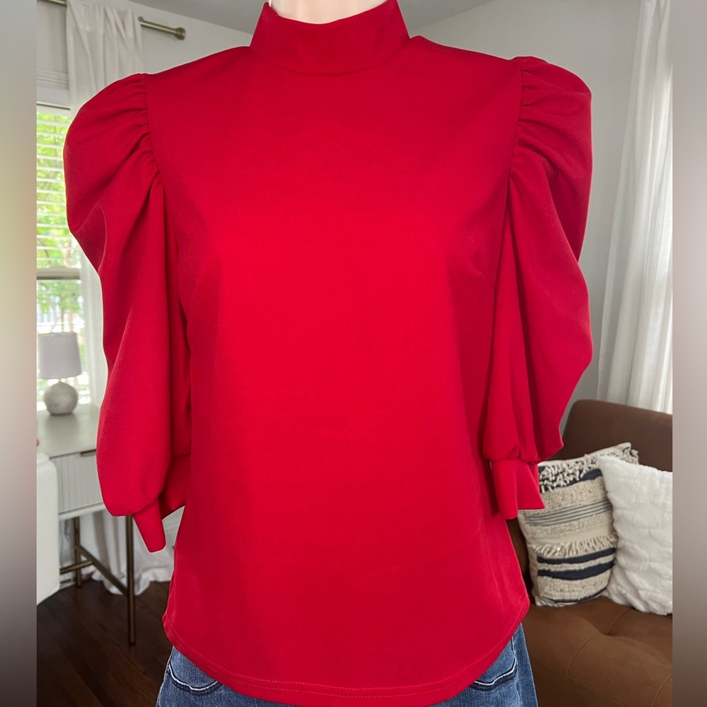 Size medium blouse with 3/4 length sleeve and high neckline